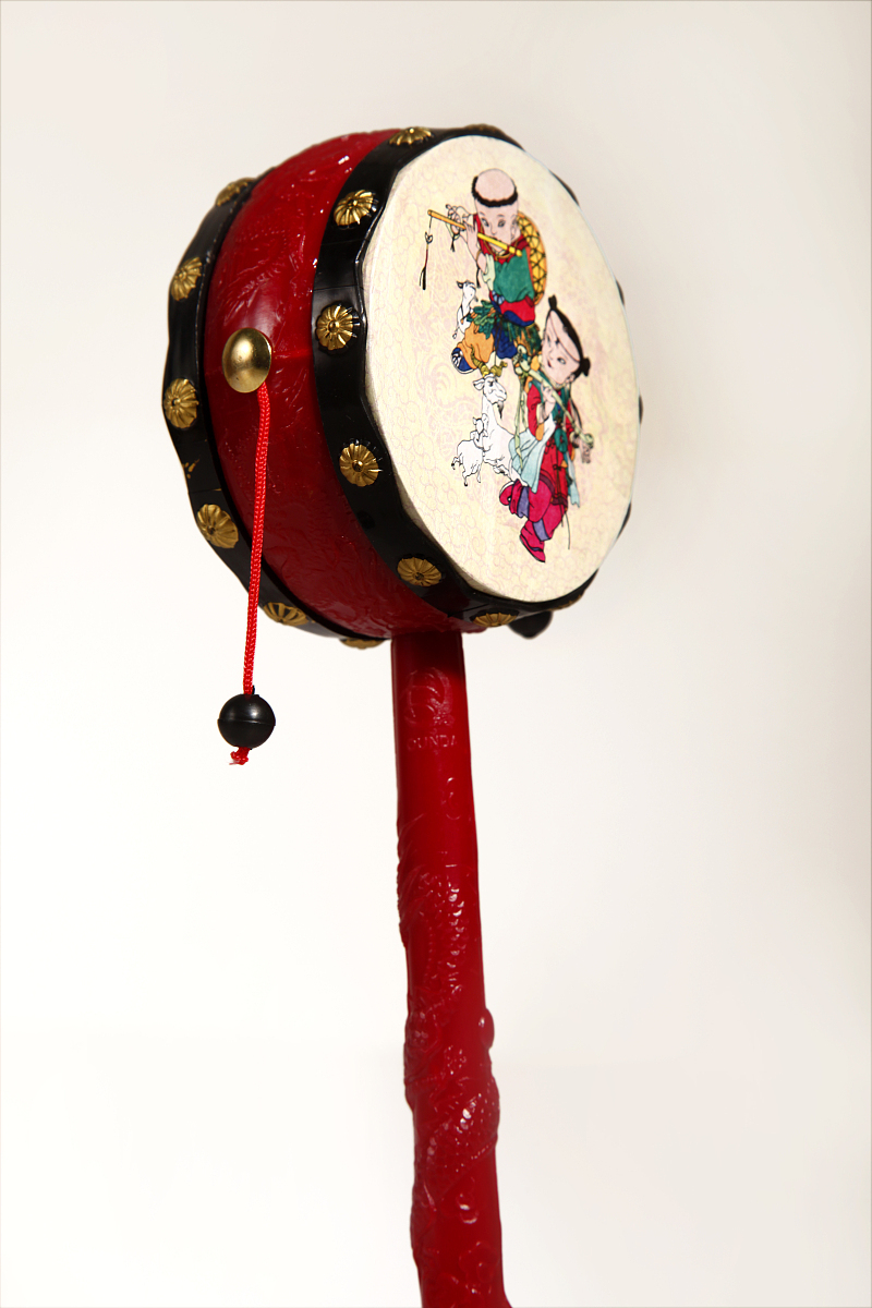拨浪鼓(其他游戏相关)拨浪鼓是一种古老又传统的民间乐器和玩具,出现